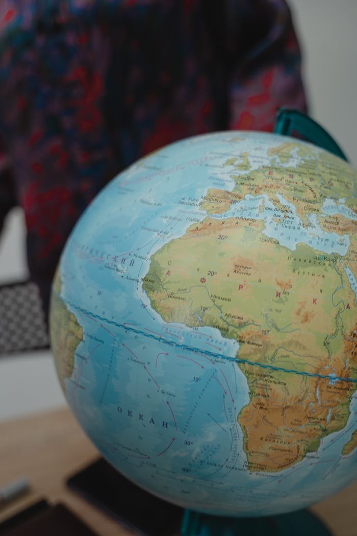 Close-up of a globe showing Africa and Europe, ideal for educational content.